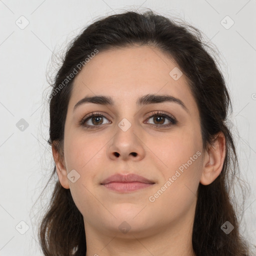 Neutral white young-adult female with long  brown hair and brown eyes