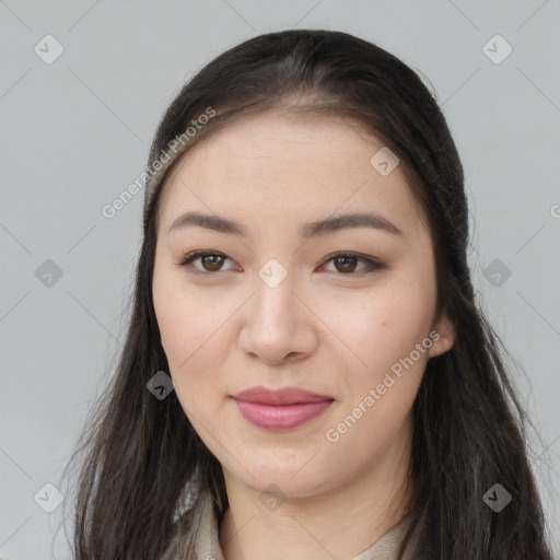 Joyful asian young-adult female with long  brown hair and brown eyes