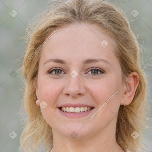 Joyful white young-adult female with medium  brown hair and blue eyes