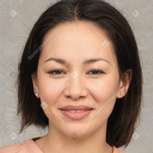 Joyful asian young-adult female with medium  brown hair and brown eyes