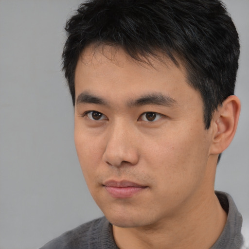 Neutral asian young-adult male with short  black hair and brown eyes