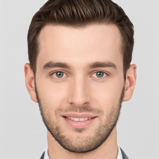 Joyful white young-adult male with short  brown hair and brown eyes