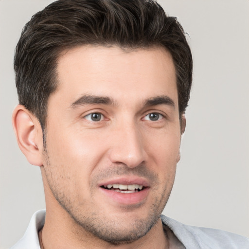 Joyful white young-adult male with short  brown hair and brown eyes