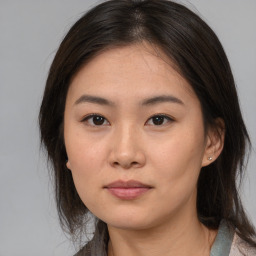 Neutral asian young-adult female with medium  brown hair and brown eyes