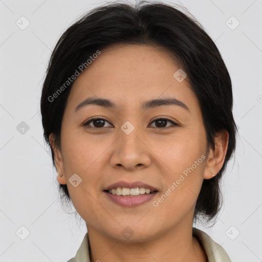 Joyful asian young-adult female with medium  brown hair and brown eyes