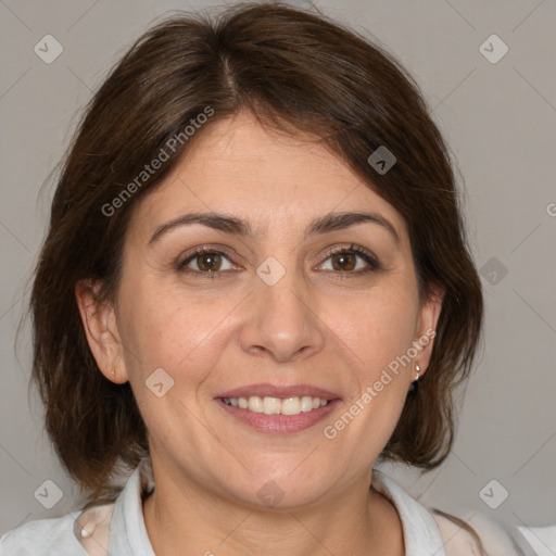 Joyful white adult female with medium  brown hair and brown eyes