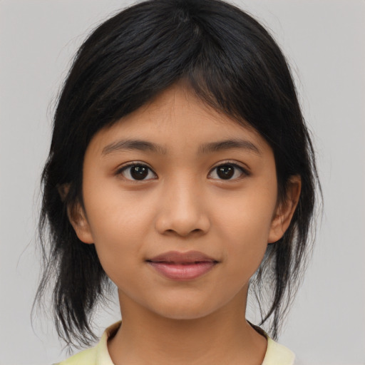 Joyful asian child female with medium  brown hair and brown eyes