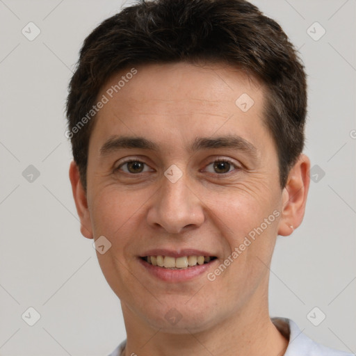 Joyful white adult male with short  brown hair and brown eyes