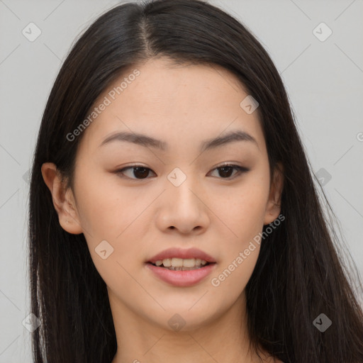 Joyful asian young-adult female with long  brown hair and brown eyes