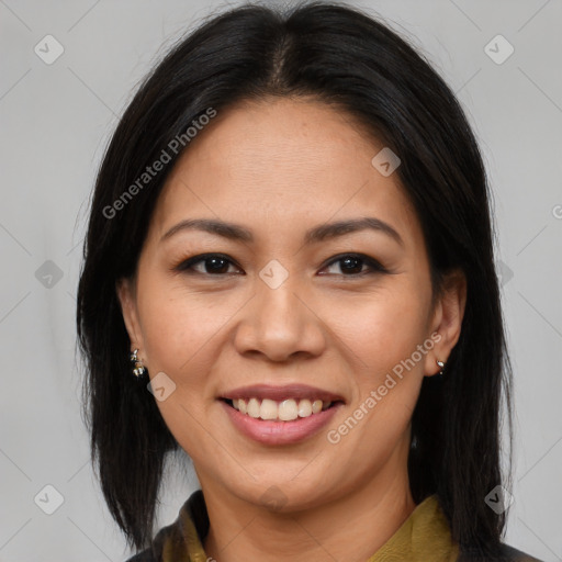 Joyful latino young-adult female with medium  brown hair and brown eyes