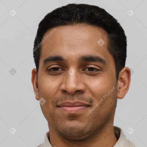 Joyful latino young-adult male with short  black hair and brown eyes