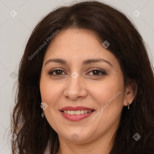 Joyful white adult female with long  brown hair and brown eyes