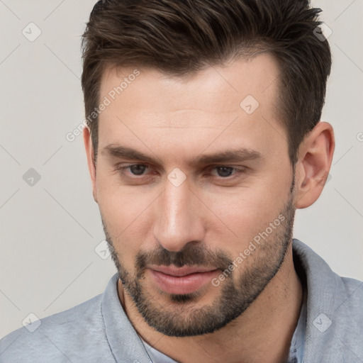 Neutral white young-adult male with short  brown hair and brown eyes