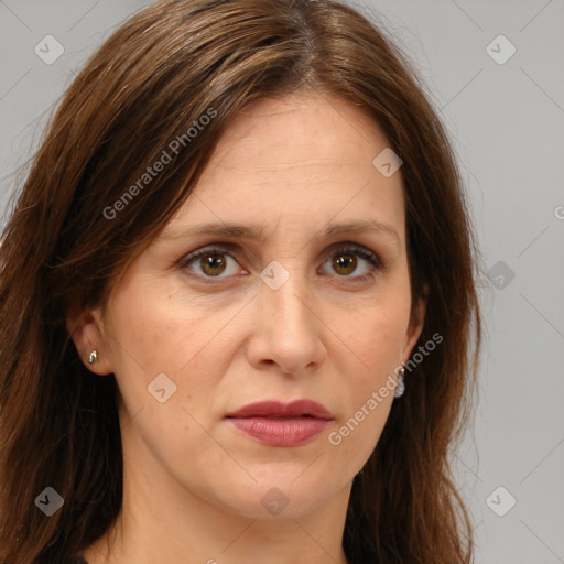 Joyful white adult female with long  brown hair and brown eyes