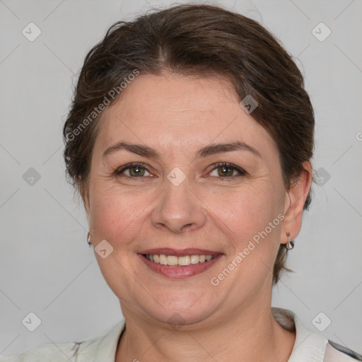 Joyful white adult female with short  brown hair and brown eyes