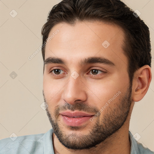 Joyful white young-adult male with short  brown hair and brown eyes