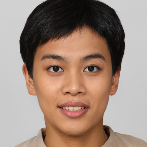 Joyful asian young-adult male with short  black hair and brown eyes