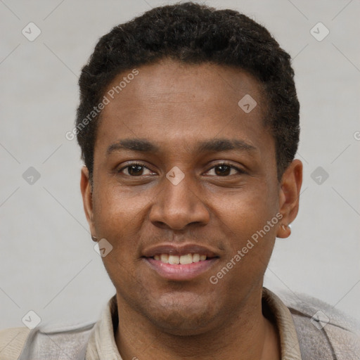 Joyful latino young-adult male with short  brown hair and brown eyes