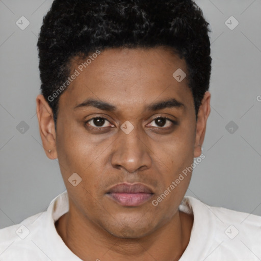 Joyful black young-adult male with short  brown hair and brown eyes