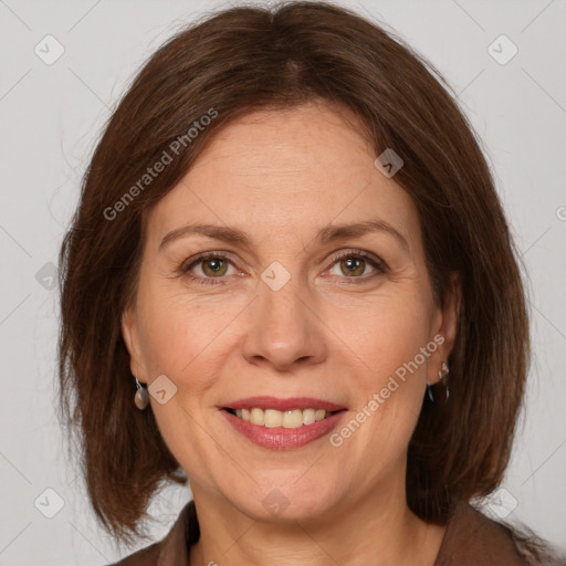 Joyful white adult female with medium  brown hair and grey eyes