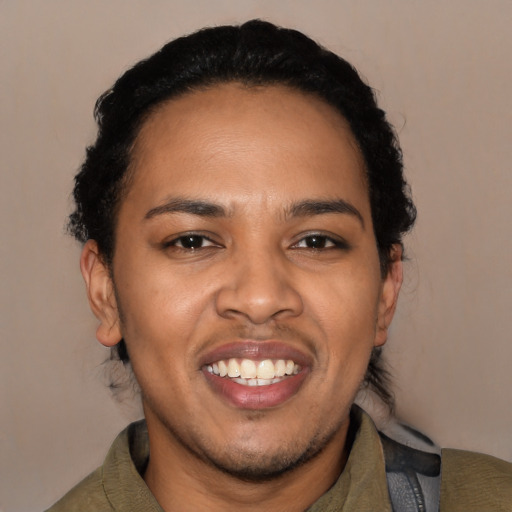 Joyful black young-adult male with short  black hair and brown eyes