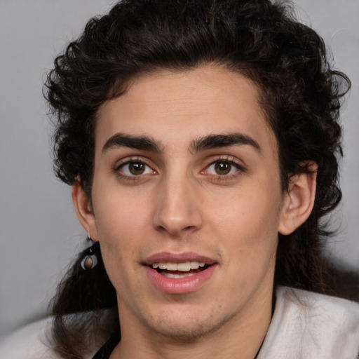 Joyful white young-adult male with medium  brown hair and brown eyes