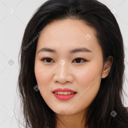 Joyful asian young-adult female with long  brown hair and brown eyes