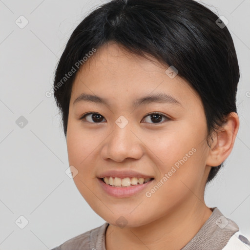 Joyful asian young-adult female with short  brown hair and brown eyes