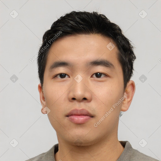 Neutral asian young-adult male with short  black hair and brown eyes