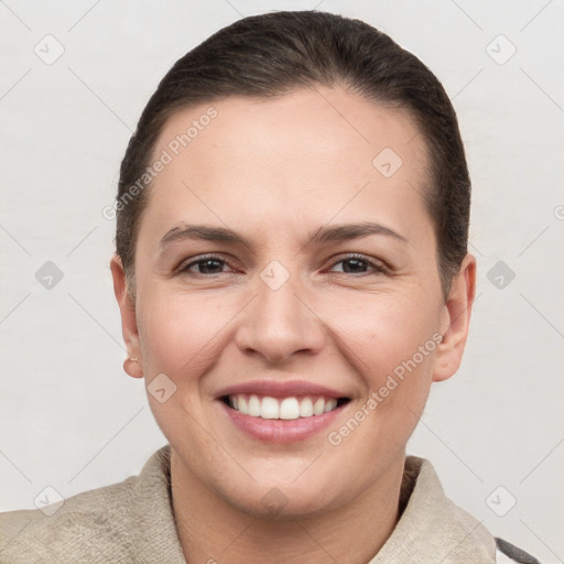 Joyful white young-adult female with short  brown hair and brown eyes