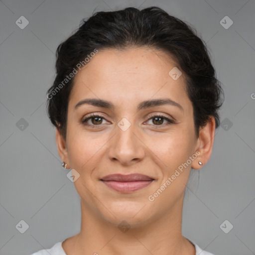 Joyful latino young-adult female with short  brown hair and brown eyes