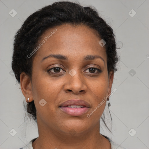 Joyful black adult female with medium  brown hair and brown eyes