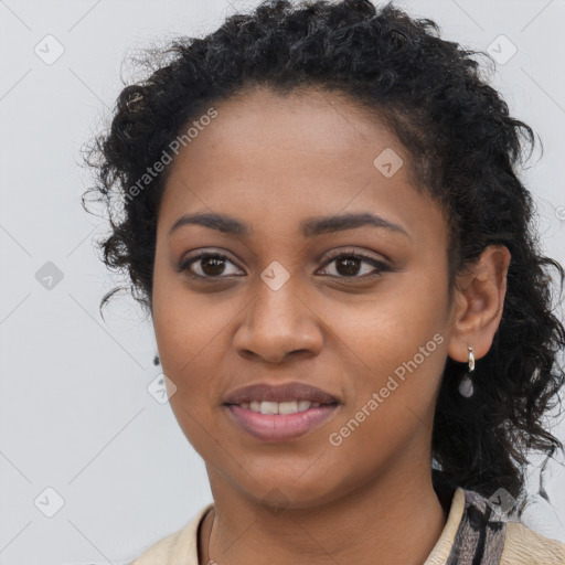 Joyful black young-adult female with long  brown hair and brown eyes