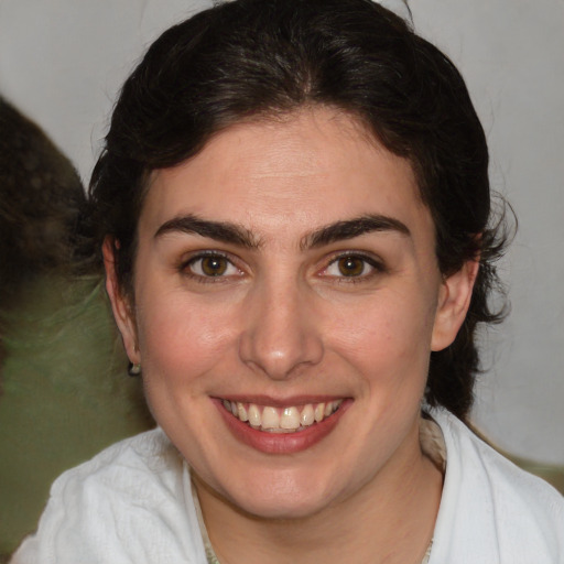 Joyful white young-adult female with medium  brown hair and brown eyes