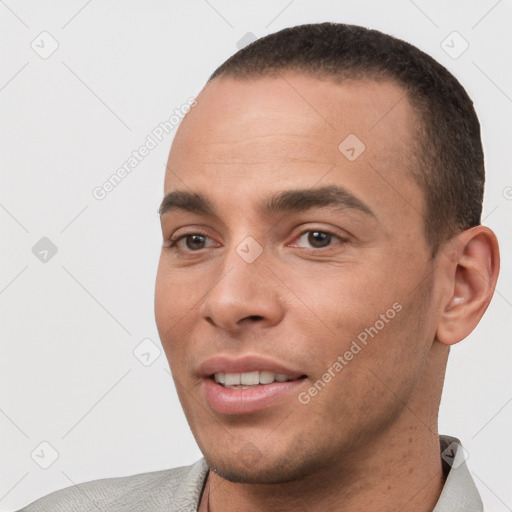 Joyful white young-adult male with short  black hair and brown eyes