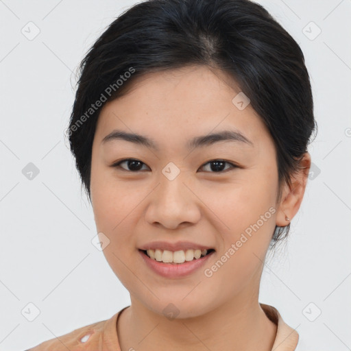 Joyful asian young-adult female with medium  brown hair and brown eyes