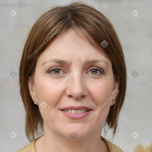 Joyful white adult female with medium  brown hair and grey eyes