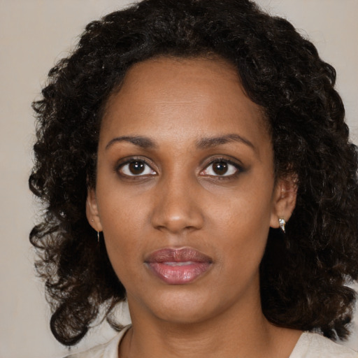 Neutral black young-adult female with medium  black hair and brown eyes