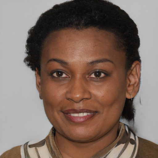 Joyful latino adult female with short  brown hair and brown eyes