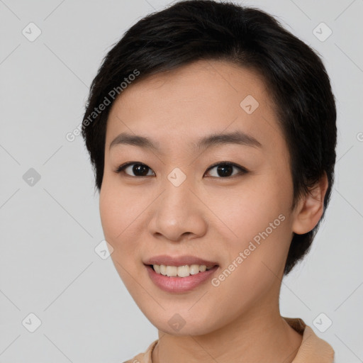 Joyful asian young-adult female with short  brown hair and brown eyes