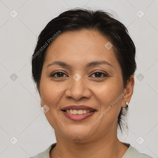 Joyful asian adult female with medium  brown hair and brown eyes