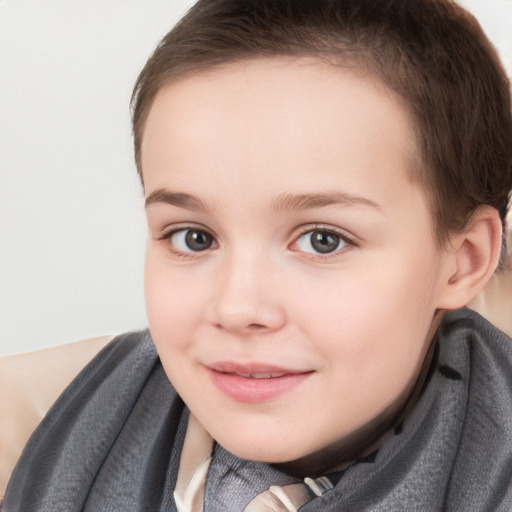 Joyful white child female with short  brown hair and brown eyes