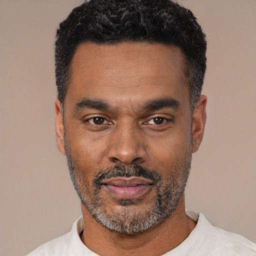 Neutral latino adult male with short  black hair and brown eyes