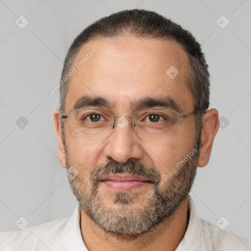 Joyful white adult male with short  black hair and brown eyes