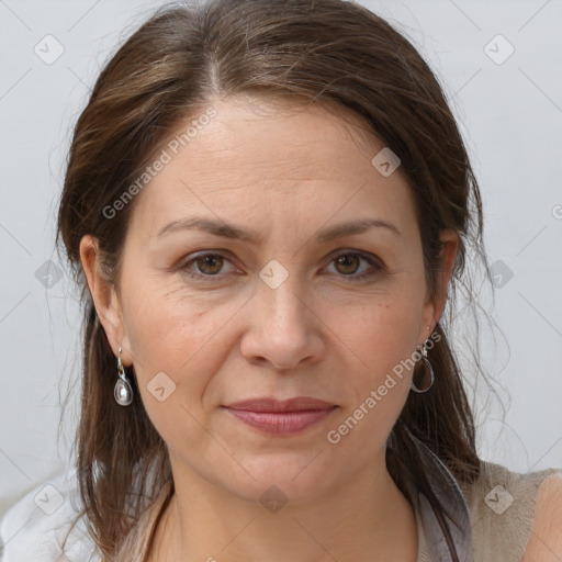 Joyful white adult female with medium  brown hair and brown eyes