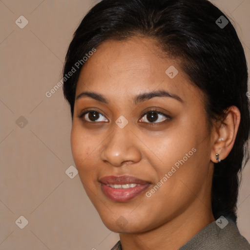 Joyful latino young-adult female with medium  brown hair and brown eyes