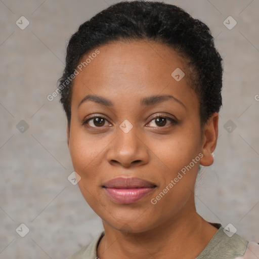 Joyful black young-adult female with short  black hair and brown eyes