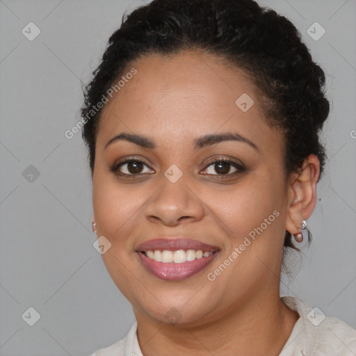 Joyful latino young-adult female with short  brown hair and brown eyes