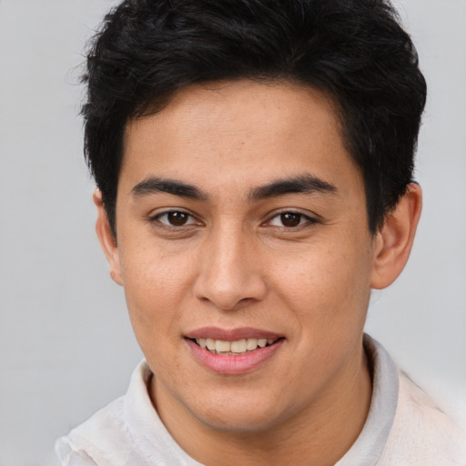 Joyful asian young-adult male with short  brown hair and brown eyes
