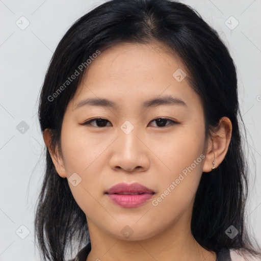 Joyful asian young-adult female with medium  brown hair and brown eyes